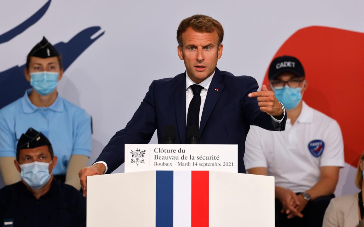 French President Emmanuel Macron delivers a speech during his visit at the police academy of Roubaix, France - Shutterstock