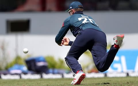 England's Jason Roy drops West Indies' Chris Gayle - Credit: AP Photo