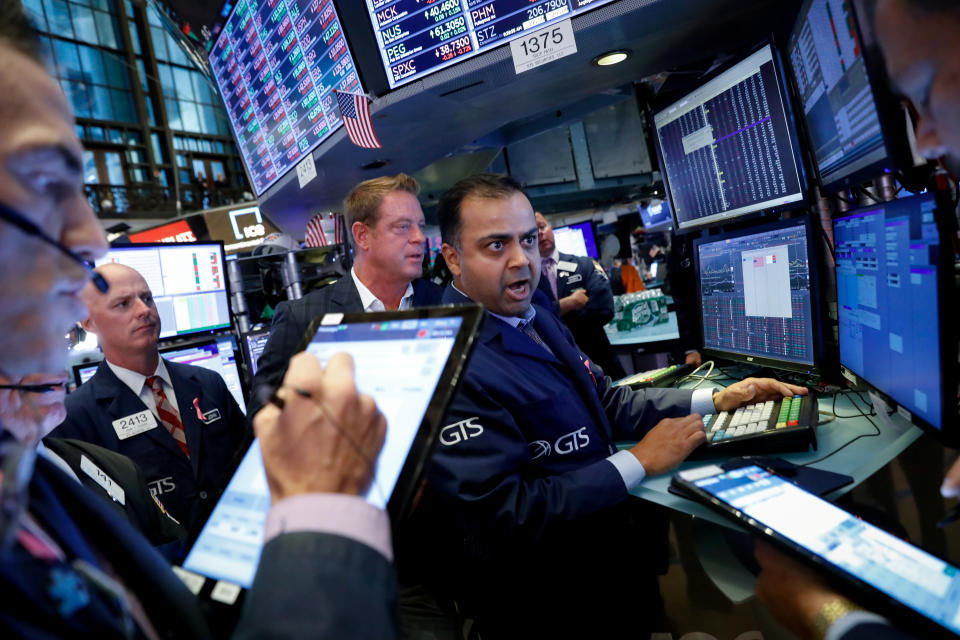 Traders work on the floor at the New York Stock Exchange (NYSE) in New York, U.S., October 3, 2019. REUTERS/Brendan McDermid