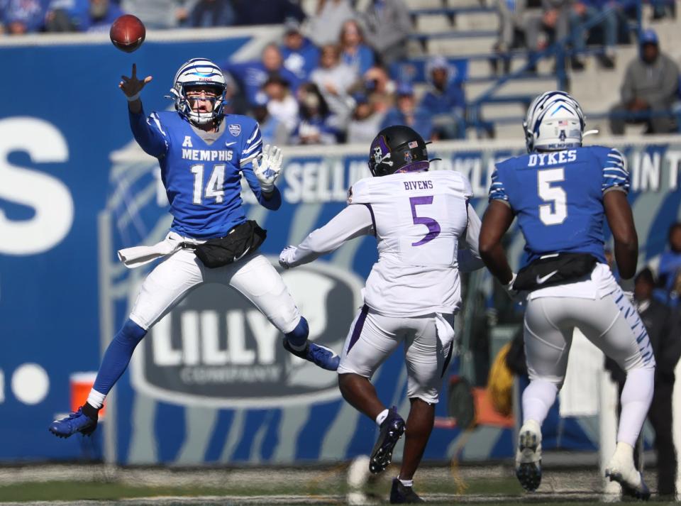 Memphis Tigers quarterback Seth Henigan throws the ball against the ECU Pirates during their game at Liberty Bowl Memorial Stadium on Saturday, Nov. 13, 2021. 