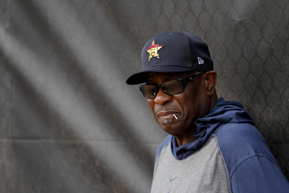 Houston Astros manager Dusty Baker leans against at fence during spring training baseball practice Thursday, Feb. 13, 2020, in West Palm Beach, Fla. (AP Photo/Jeff Roberson)