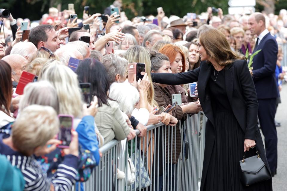 Catherine, Princess of Wales and Prince William, Prince of Wales view floral tributes at Sandringham