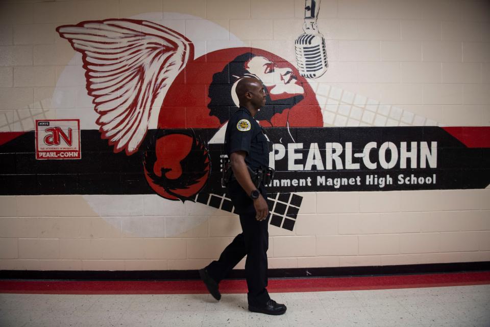 Freddirico Pye, a school resource officer who has been working at Pearl-Cohn High School for the last 7 years walks the halls in the school in Nashville , Tenn., Friday, May 12, 2023.