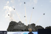 President Donald Trump watches a flyover by the U.S. Navy Blue Angles at Mount Rushmore National Memorial, Friday, July 3, 2020, near Keystone, S.D. (AP Photo/Alex Brandon)