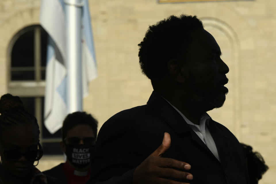 Ira Acree of Greater St. John Bible Church speaks during a rally to protest former Chicago Mayor Rahm Emanuel's appointment as ambassador to Japan outside the Chicago Police Headquarters Tuesday, Oct. 19, 2021, in Chicago. The fatal police shooting of a Black teen in Chicago seven years ago is looming large over the city’s former mayor, Emanuel, as he looks to win confirmation as President Joe Biden’s ambassador to Japan.(AP Photo/Paul Beaty)