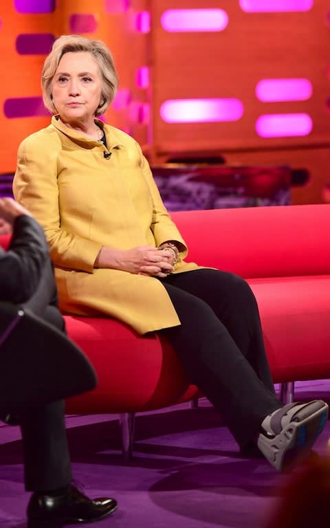 Hillary Clinton appeared on the BBC's Graham Norton Show wearing a surgical boot. - Credit: Ian West/PA