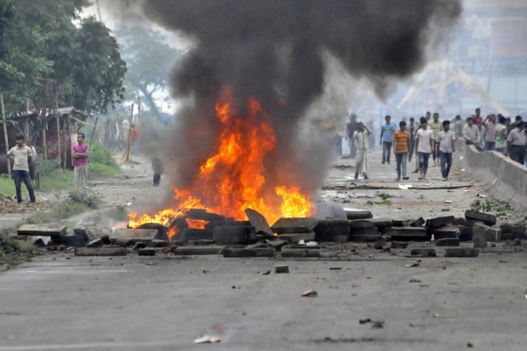 A fire burns as Islamist protestors clash with Bangladeshi police in Narayanganj, some 20 kms from Dhaka, on May 6, 2013. Bangladeshi police broke up a protest by tens of thousands of religious hardliners and shut down Islamist television stations Monday as 37 people died in some of the fiercest street violence for decades