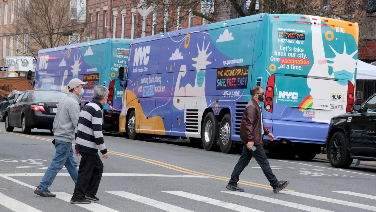 An NYC Mobile Vaccine Clinic bus is seen parked on Seventh Avenue and 54th Street in Brooklyn, New York.