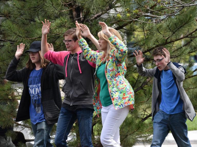 A student killed in a school shooting in Denver, Colorado, was hailed a hero after classmates described how he attempted to tackle the gunman as shots rang out. Kendrick Castillo led the charge against their teenage classmate with two others, one of whom managed to wrestle the gun away.But 18-year-old Mr Castillo slumped to the ground. He was the only student to be killed, while eight others were injured.Authorities said the actions of Mr Castillo, his close friend Brendan Bialy and Joshua Jones minimised the bloodshed from Tuesday's attack at the school south of Denver."Kendrick went out as a hero," Mr Bialy said. "He was a foot away from the shooter and instead of running the opposite direction he ran toward it.""Kendrick lunged at (the gunman), and he shot Kendrick, giving all of us enough time to get underneath our desks, to get ourselves safe, and to run across the room to escape,” fellow classmate Nui Giasolli told NBC.Some are now calling for the school to be renamed in his honour. A member of the school's robotics club, Mr Castillo had an infectious smile and gentle sense of humour, according to friends.He worked part-time at a local manufacturing company that had offered him a job after an internship because he was such a standout employee."To find he went down as a hero, I'm not surprised. That's exactly who Kendrick was," said Rachel Short, president of the company, Baccara.Police said the shooting happened after two shooters walked into the school, "got deep inside the school, and engaged students in two separate locations".The injured includes Mr Jones, who was shot twice, according to a statement released by his family.Mr Bialy acknowledged that he was scared, but he said he was not going to cower for attackers he repeatedly called cowards."They lost," he said. "They completely and utterly lost to good people."He was speaking as two teenagers made their first court appearances in connection with the shooting.Devon Erickson, 18, kept his head down with his black hair, streaked with purple dye, covering his face as he nodded in response to most of District Court Judge Theresa Slade's questions.At one point, the judge requested a verbal answer to whether he had any questions about the proceedings. Erickson simply replied "No".Maya McKinney, 16, whose lawyer said uses male pronouns and the name Alec, and has short brown hair, made eye contact with the judge and answered questions in a clear but quiet voice, saying "Yes, your honour" and "No, your honour".District attorney George Brauchler said he has not decided whether to file adult charges but added that McKinney is old enough to be charged as an adult without a judge's review.Formal charges are expected to be filed by Friday. Mr Brauchler said he could not discuss any motive or weapons used in the attack.Both suspects were students at the school, and they were not previously known to authorities, officials said.Additional reporting by AP