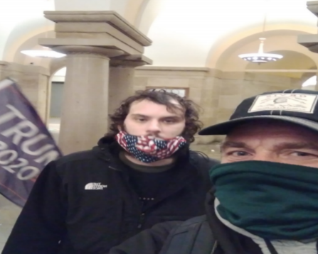 Brian Stenz (in the green mask) allegedly texted this photo to a friend on Jan. 6. That friend sent it to the police.