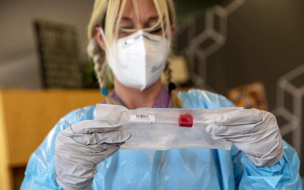 A phlebotomist prepares to administer Covid-19 tests to employees at the Intermountain Regional Landfill office in Sandy, Utah -  Kim Raff/Bloomberg