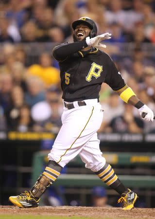 Sep 15, 2015; Pittsburgh, PA, USA; Pittsburgh Pirates second baseman Josh Harrison (5) reacts after striking out against Chicago Cubs starting pitcher Jon Lester (not pictured) during the eighth inning at PNC Park. Mandatory Credit: Charles LeClaire-USA TODAY Sports