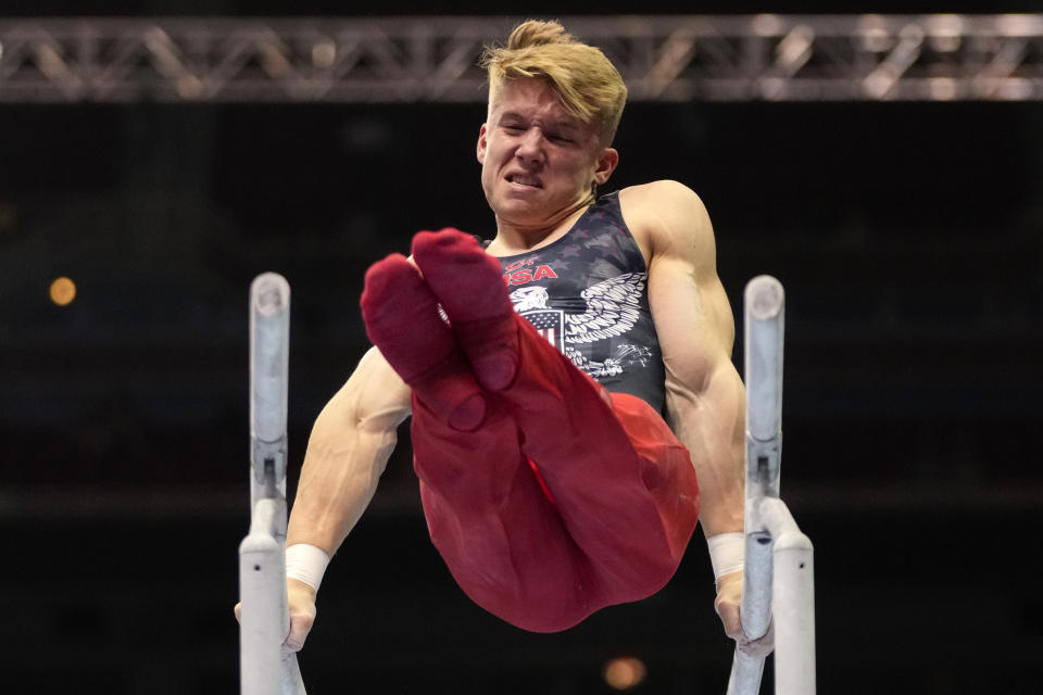 Shane Wiskus competes on the parallel bars during the men's U.S. Olympic Gymnastics Trials Saturday, June 26, 2021, in St. Louis. (AP Photo/Jeff Roberson)