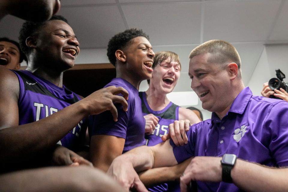 Pickerington Central coach Eric Krueger and his players celebrate their win Saturday in a Division I state semifinal.