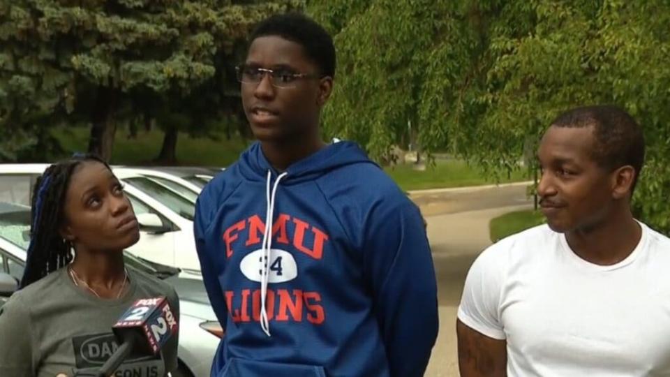 Brennan Walker (center), shown with his mother, Lisa, and stepfather, Steven, chose a Florida HBCU “because I feel like I know a lot of people here — and I want to be surrounded by new people.” (Fox 2 Detroit. )