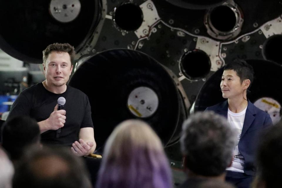 SpaceX founder and chief executive Elon Musk and space tourist billionaire Yusake Maezawa (AP)