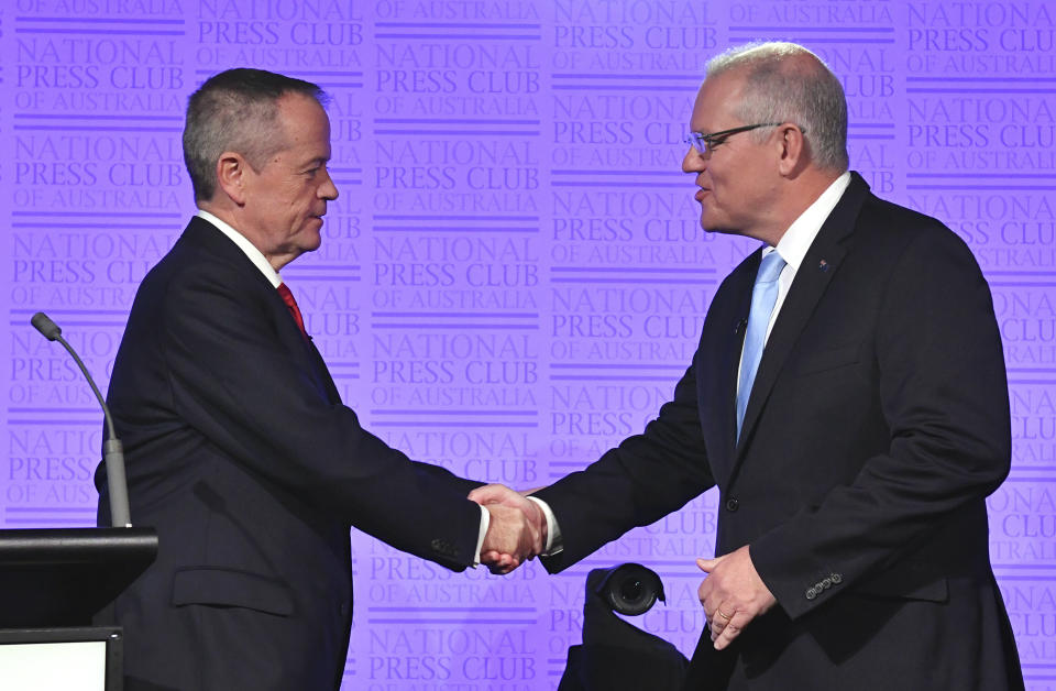 Australian Prime Minister Scott Morrison and Bill Shorten, leader of the federal opposition, shake hands before the third leaders debate at the National Press Club in Canberra.