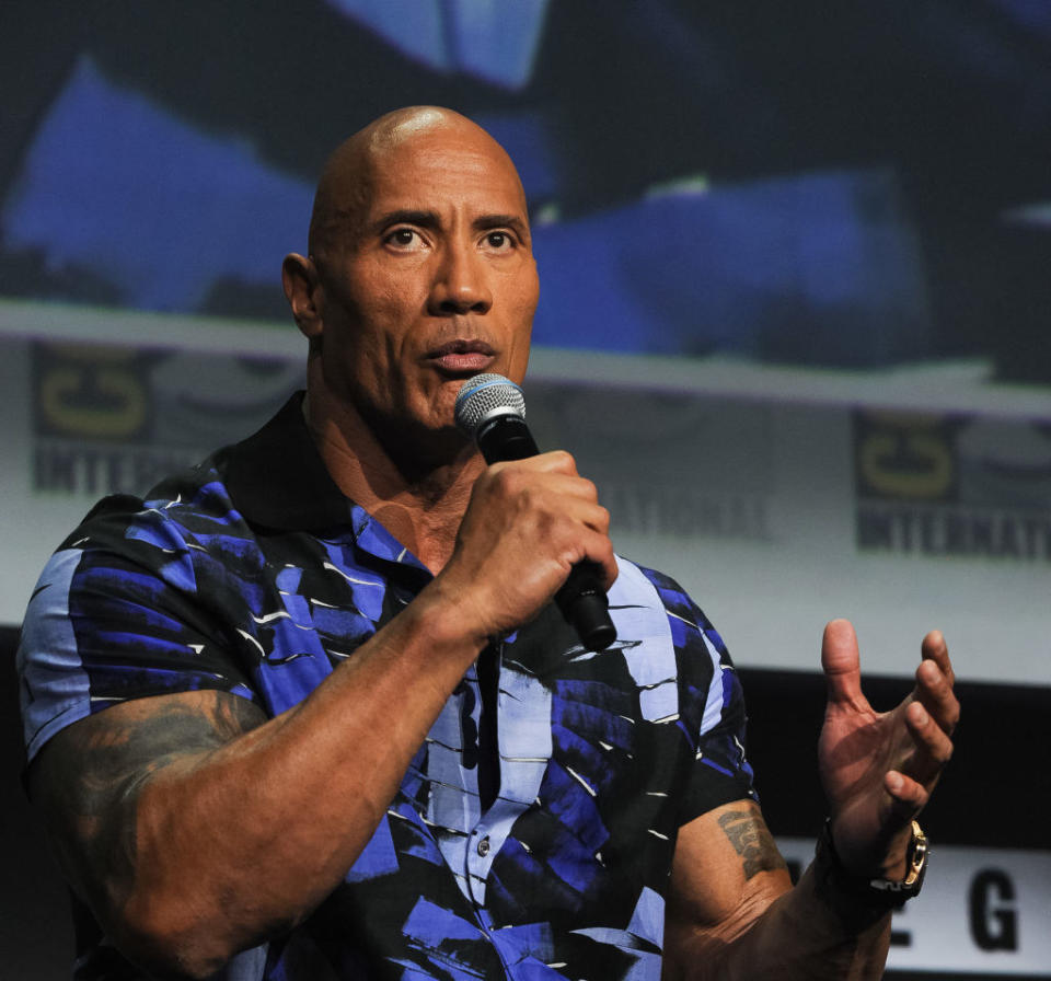 Dwayne Johnson speaks onstage at the Warner Bros. theatrical panel