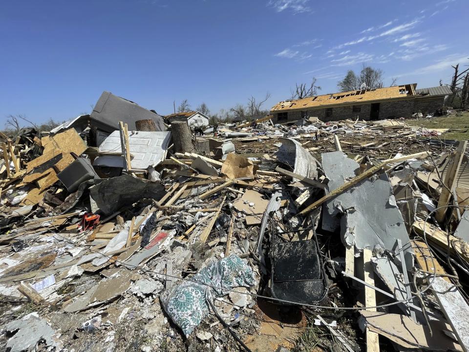 Debris covers the ground on Saturday, March 25, 2023 in Silver City, Miss. Emergency officials in Mississippi say several people have been killed by tornadoes that tore through the state on Friday night, destroying buildings and knocking out power as severe weather produced hail the size of golf balls moved through several southern states. (AP Photo/Michael Goldberg)