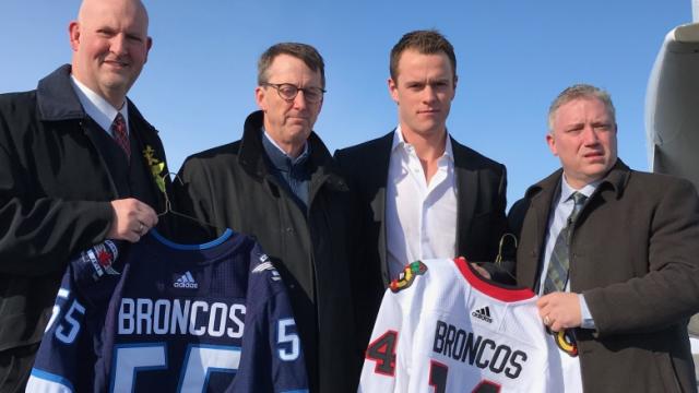 Jonathan Toews, Winnipeg Jets exec Mark Chipman deliver NHL game jerseys  with Broncos name plates to