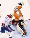 Montreal Canadiens center Jesperi Kotkaniemi (15) scores against a stickless Philadelphia Flyers goaltender Carter Hart (79) during the first period of NHL hockey Eastern Conference Stanley Cup first-round playoff action against the Montreal Canadiens in Toronto, Friday, Aug. 14, 2020. (Frank Gunn/The Canadian Press via AP)