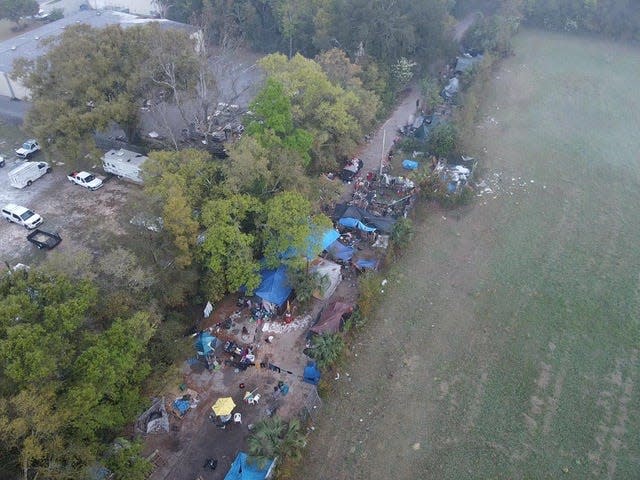 Drone image of homeless campers behind businesses on the 4300 Block of North Palafox Street. Business owners say the transients bring an array of problems.
