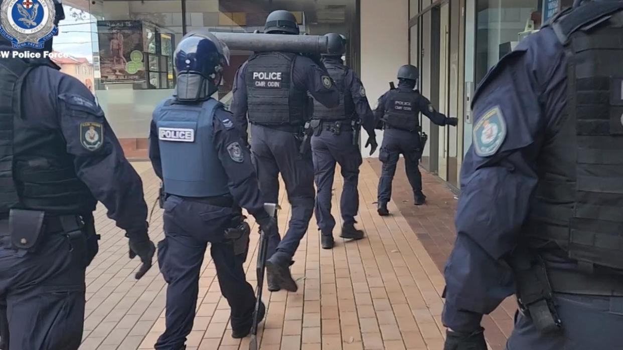 The moment police descended on the unit of Zahra Rachid before she was arrested over the alleged fraud. Picture: NSW Police