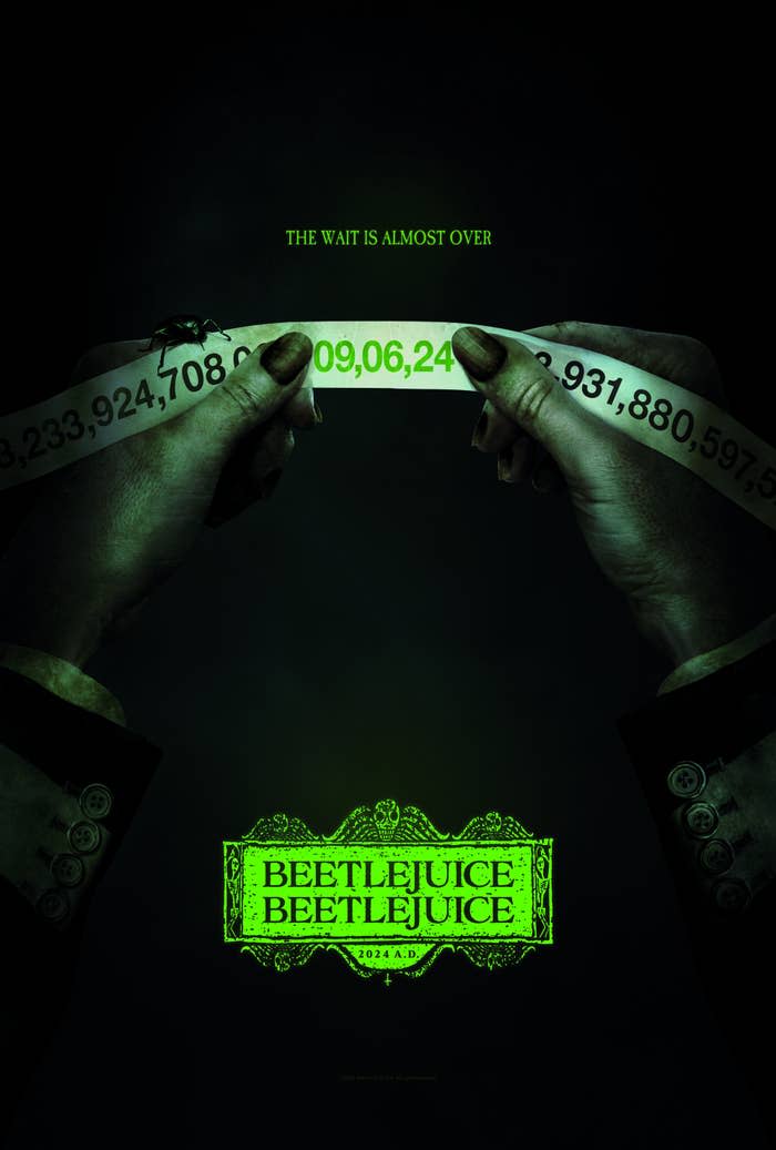 Movie poster for "Beetlejuice Beetlejuice" with hands holding a green-lit piece of paper and text about the wait being over