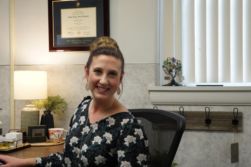 Madeline Miller, the program director of Crisis Care at Lewis and Clark Behavioral Health, at her desk inside the Benedictine Center on the Avera Sacred Heart Hospital Campus, on Monday, Sept. 25. 2023.