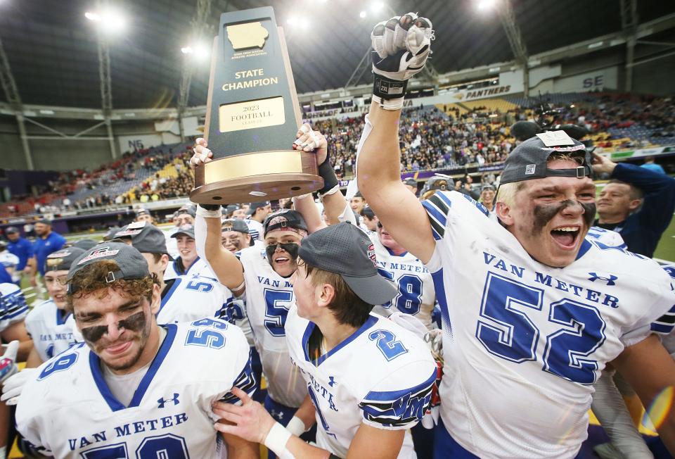 The Van Meter football team celebrates after winning the Class 2A state football championship Friday in Cedar Falls.