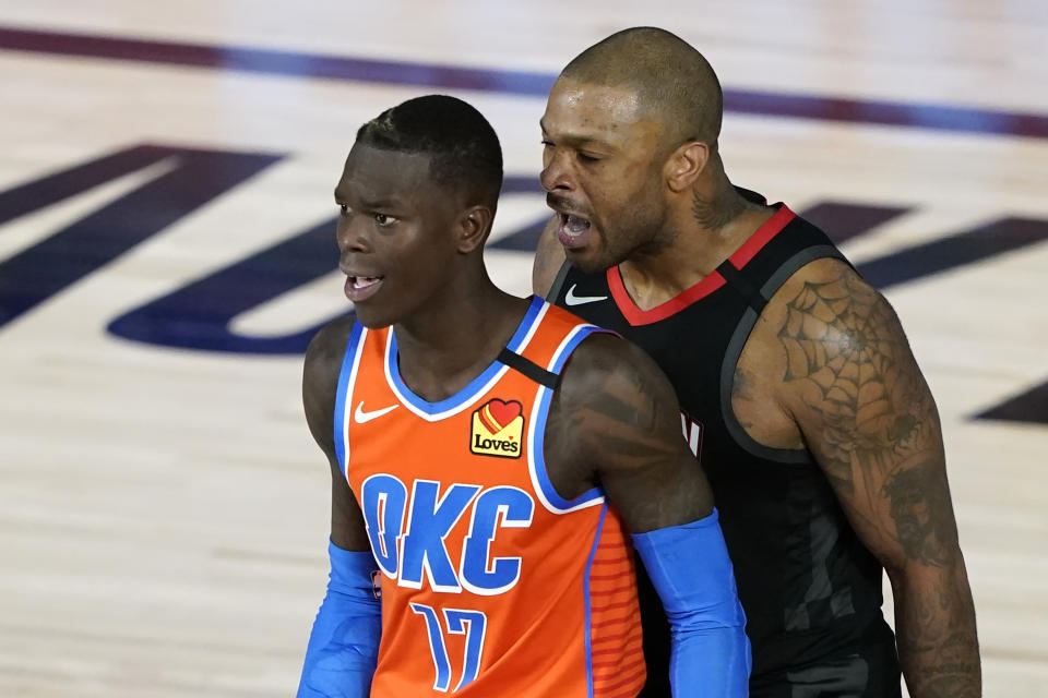 Houston Rockets' P.J. Tucker, right, yells as Oklahoma City Thunder's Dennis Schroder (17) after a foul during the second half of an NBA basketball first round playoff game Saturday, Aug. 29, 2020, in Lake Buena Vista, Fla. Both players were ejected. (AP Photo/Ashley Landis)