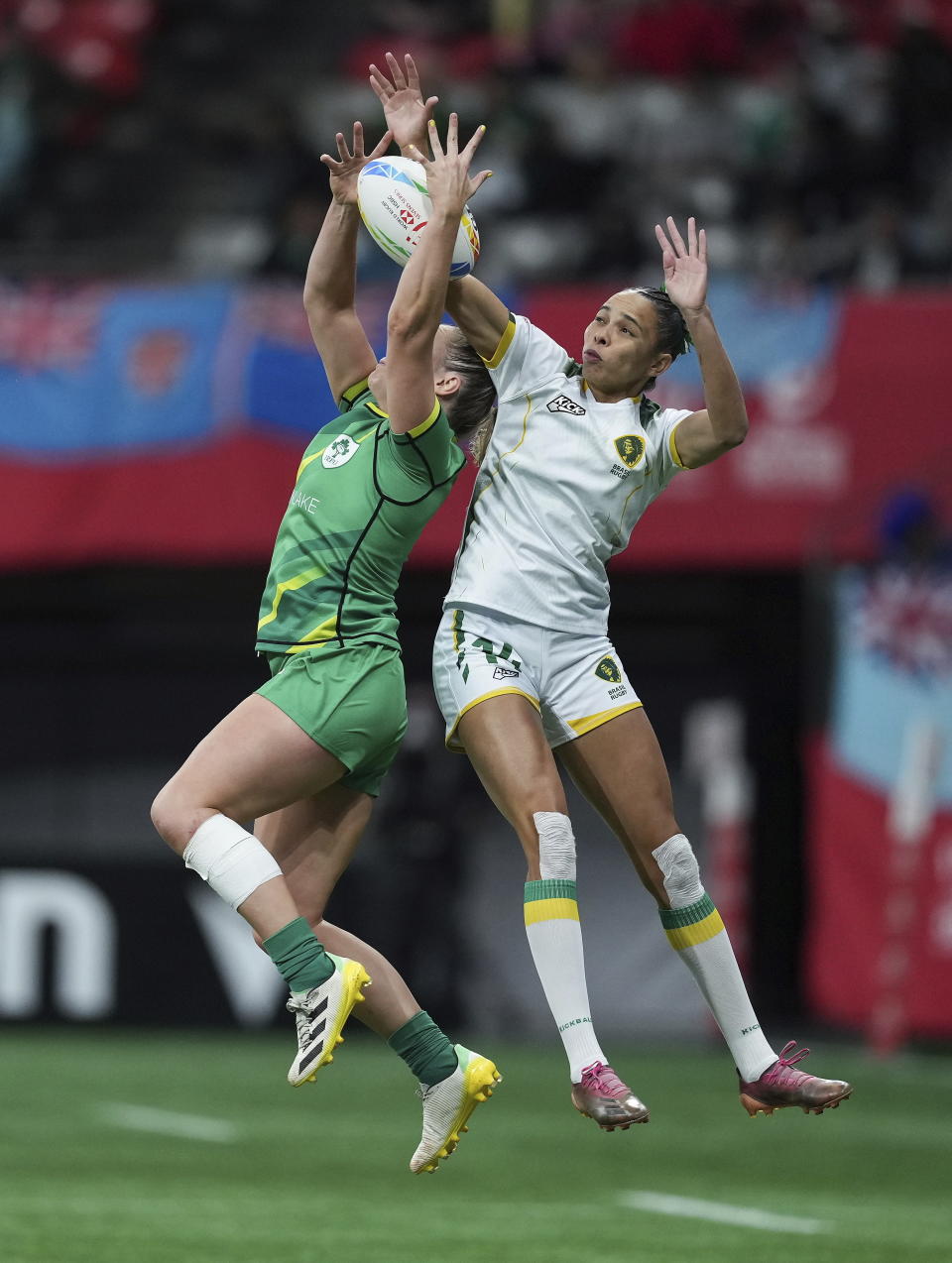 Brazil's Gabriela Lima, right, and Ireland's Stacey Flood vie for the ball during a Canada Sevens women's rugby match in Vancouver, British Columbia, Friday, March 3, 2023. (Darryl Dyck/The Canadian Press via AP)