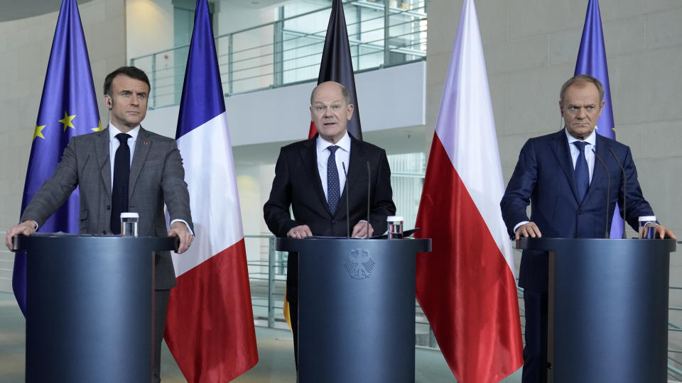 German Chancellor Olaf Scholz, center, French President Emmanuel Macron, left, and Poland's Prime Minister Donald Tusk talk to the media at a press conference in Berlin, Germany, Friday, March 15, 2024. German Chancellor Olaf Scholz, France's President Emmanuel Macron and Poland's Prime Minister Donald Tusk meet in Berlin for the so-called Weimar Triangle talks. (AP Photo/Ebrahim Noroozi)