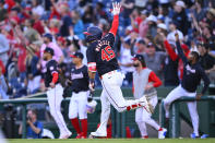 Washington Nationals' Joey Meneses runs to first base celebrating his 10th inning hit to drive in the game-winning run to defeat the Houston Astros 5-4 in a inning baseball game at Nationals Park, Saturday, April 20, 2024, in Washington. (AP Photo/John McDonnell)