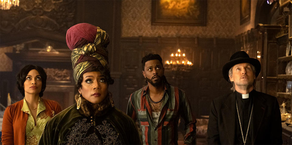 Rosario Dawson as Gabbie, Tiffany Haddish as Harriet, LaKeith Stanfield as Ben, and Owen Wilson as Father Kent in Disney's live-action HAUNTED MANSION.