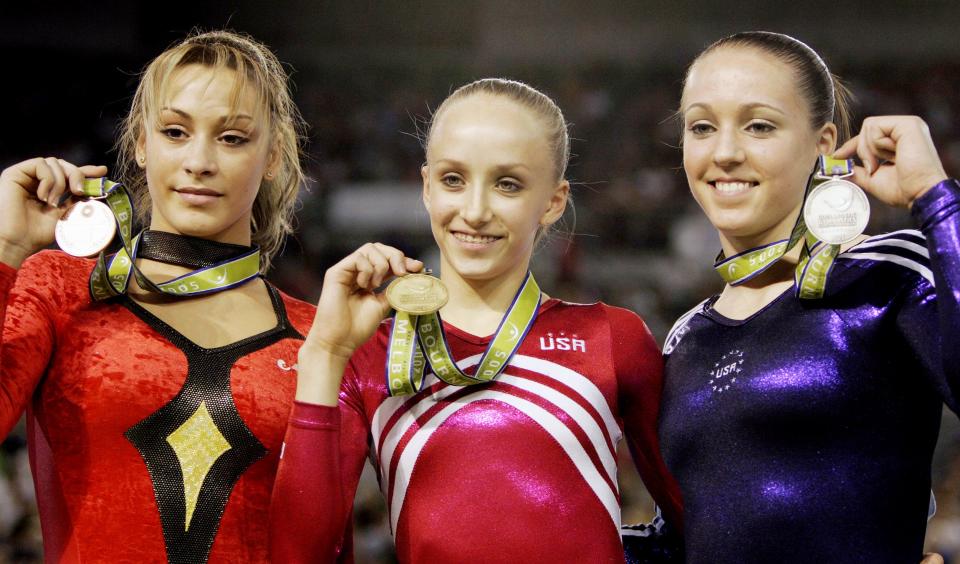 Chellsie Memmel, right, took the silver on the beam at the World Gymnastic Championships in Melbourne, Australia, Sunday, Nov. 27, 2005. Fellow American Anastasia Liukin, center, won gold, while Romania's Catalina Ponor, left, captured bronze.