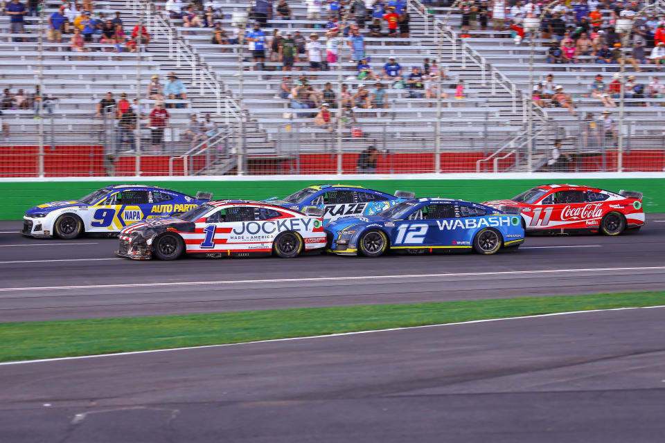 ATLANTA, GA - JULY 10: NASCAR Cup Series driver Chase Elliott (9), NASCAR Cup Series driver Ross Chastain (1), NASCAR Cup Series driver Ryan Blaney (12), NASCAR Cup Series driver Corey LaJoie (7), and NASCAR Cup Series driver Denny Hamlin (11) race in close quarters during the Quaker State 400 Presented by Walmart on July 10, 2022 at Atlanta Motor Speedway in Atlanta, GA. (Photo by Chris McDill/Icon Sportswire via Getty Images)