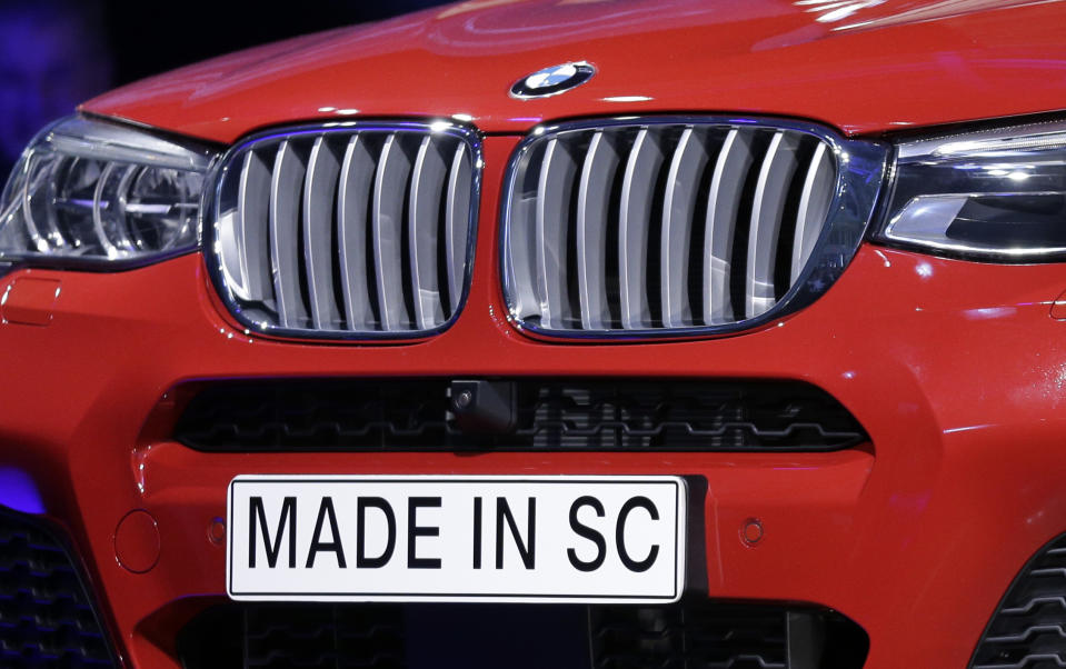 A "Made In SC" plate is shown on a new BMW X4 vehicle as it is unveiled during a news conference at the BMW manufacturing plant in Greer, S.C., Friday, March 28, 2014. The company announced a $1 billion expansion for the plant. (AP Photo/Chuck Burton)