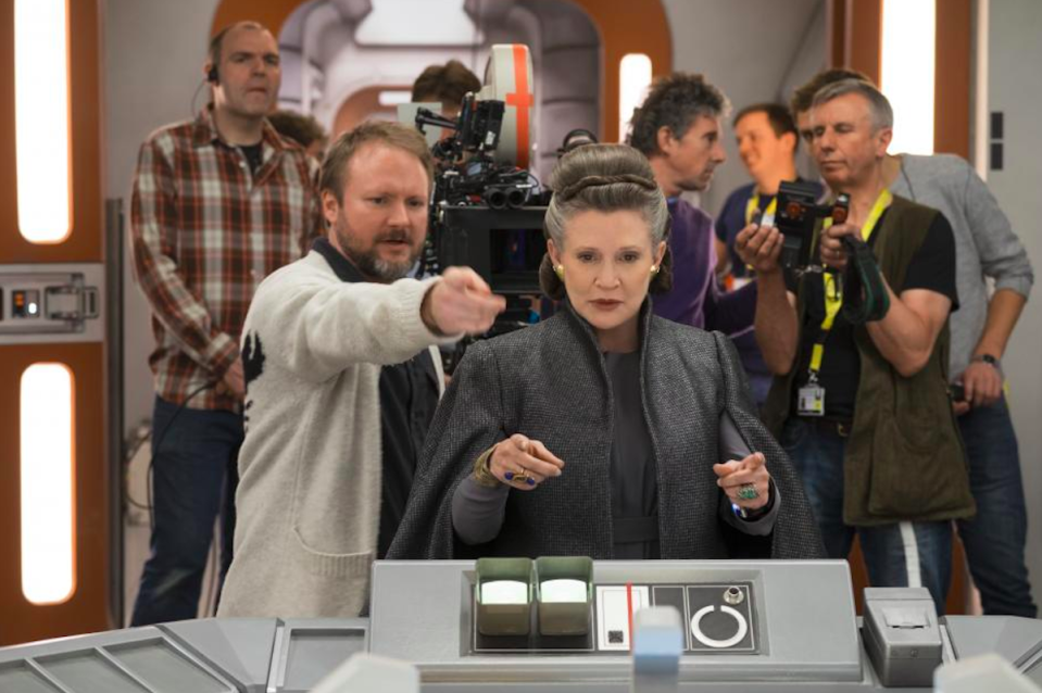 Rian Johnson (pointing) directs Carrie Fisher in <em>The Last Jedi</em>. (Credit: Lucasfilm)