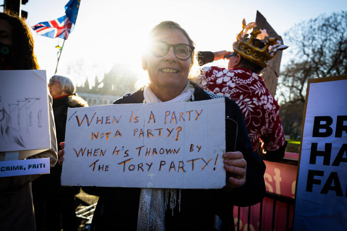 A protester holds a placard expressing his opinion during the demonstration. Protesters demonstrate against Prime Minister Boris Johnson and the 