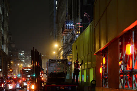 Construction continues into the night in the City of London, Britain October 18, 2017. Picture taken October 18, 2017. REUTERS/Mary Turner