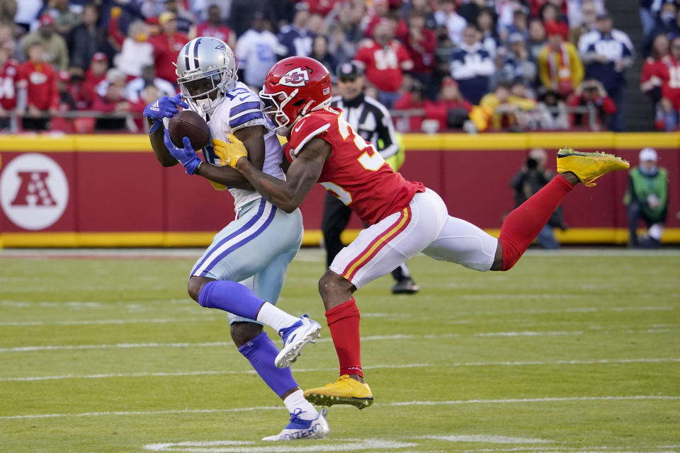 Dallas Cowboys wide receiver Michael Gallup, left, catches a pass as Kansas City Chiefs cornerback Charvarius Ward defends during the first half of an NFL football game Sunday, Nov. 21, 2021, in Kansas City, Mo. (AP Photo/Ed Zurga)