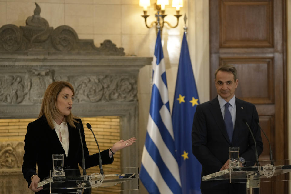 European Parliament President Roberta Metsola, left, makes a statement with Greece's Prime Minister Kyriakos Mitsotakis after their meeting at Maximos Mansion in Athens, Greece, Tuesday, Feb. 20, 2024. Metsola is in Athens on Tuesday, as part of her campaign to raise awareness and encourage people to vote in the European Parliament elections in June. (AP Photo/Thanassis Stavrakis)