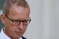 Mark Johnson, a British citizen who at the time of his arrest was HSBC's global head of foreign exchange cash trading, exits following a hearing at the U.S. Federal Court in Brooklyn, New York, U.S., August 29, 2016. REUTERS/Brendan McDermid