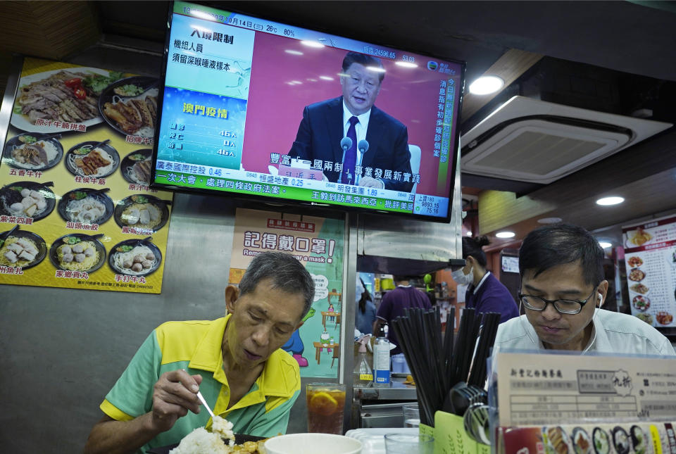 A TV screens is broadcasting Chinese President Xi Jinping during an event to commemorate the 40th anniversary of the establishment of the Shenzhen Special Economic Zone in Shenzhen in southern China's Guangdogn Province at a restaurant in Hong Kong, Wednesday, Oct. 14, 2020. Xi promised Wednesday new steps to back development of China's biggest tech center, Shenzhen, amid a feud with Washington that has disrupted access to U.S. technology and is fueling ambitions to create Chinese providers. (AP Photo/Vincent Yu)