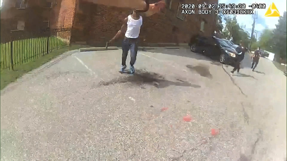 This image from video released by the Metropolitan Police Department, shows body cam video during a foot pursuit with Deon Kay, center, in Washington, on Wednesday afternoon, Sept. 2, 2020. Police in the nation’s capital released body camera footage from the officer who fatally shot the Black 18-year-old in the chest. (Metropolitan Police Department via AP)