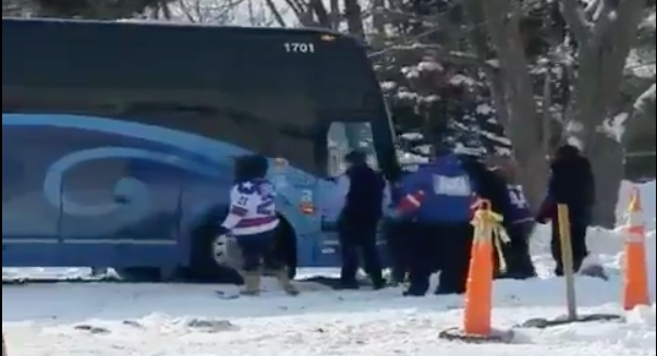 Fans helped push Team USA’s bus out of the snow ahead of the first outdoor game in WJC history. How fitting.