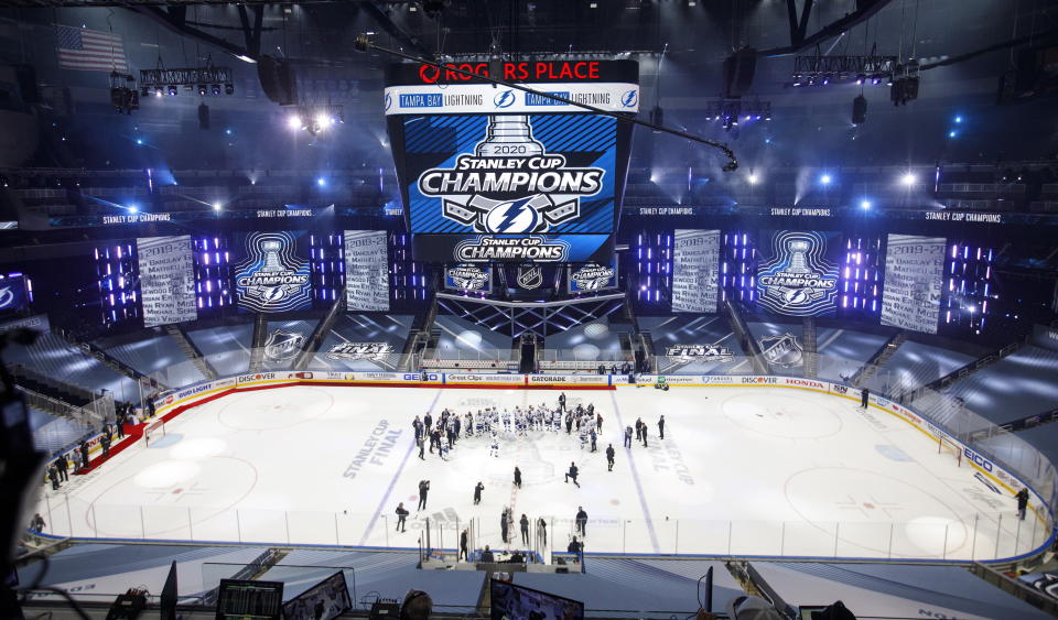 Tampa Bay Lightning players celebrate after defeating the Dallas Stars to win the Stanley Cup in the NHL Stanley Cup hockey finals, in Edmonton, Alberta, on Monday, Sept. 28, 2020. (Jason Franson/The Canadian Press via AP)