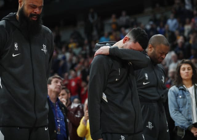 Houston Rockets centre Tyson Chandler, guard Austin Rivers and forward P.J. Tucker reacted during a tribute