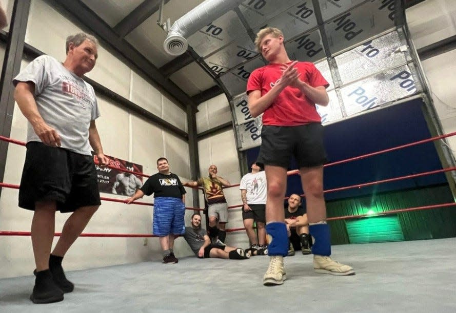James and Jarron train together in a wrestling ring.